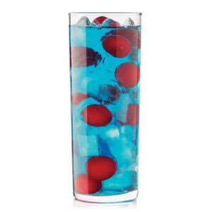 Fresh blue drink with ice and red berries in a tall glass, refreshing beverage ideal for summer.