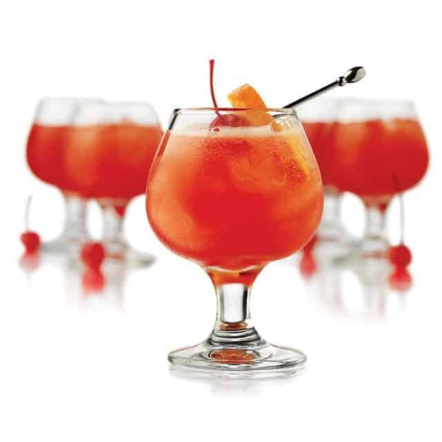 0020172_2.jpg Sunset cocktails with orange garnish in elegant glasses, perfect for leisure or celebrations, emphasizing premium beverage presentation.