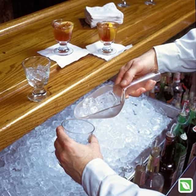 0040100_3.jpg Ice bucket with bartender pouring drinks in a bar setting at Beyond Hygiene Asia for safe beverage service and hygiene standards.