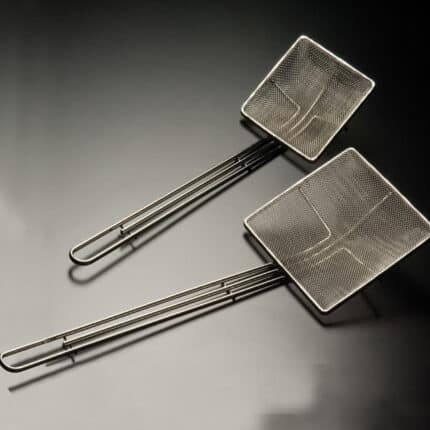 Stainless steel kitchen skimmer and slotted spoon, professional-grade cooking tools, durable mesh strainers for food prep and frying, essential utensils for Asian cuisine and beyond.