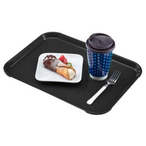 Freshly prepared ice cream cone with strawberries on a black tray, accompanied by a coffee cup and fork, showcasing food service hygiene and cleanliness.