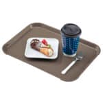 Brown plastic tray with a dessert, a coffee cup, and a fork for hygiene and safety in food service environments.