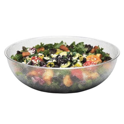 Fresh veggie and fruit salad with vibrant greens, cherry tomatoes, blueberries, and cucumbers in a clear glass bowl, promoting healthy eating and nutrition.