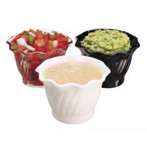 Fresh guacamole, salsa, and sour cream served in decorative bowls, ideal for catering or restaurant presentation.