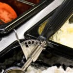 Heavy-duty commercial ice cream scoop and dispenser cleaning station at Beyond Hygiene Asia, offering professional hygiene solutions for foodservice businesses.