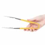 Tongs with yellow handle for food serving and hygiene purposes, ideal for safe and sanitary food handling.