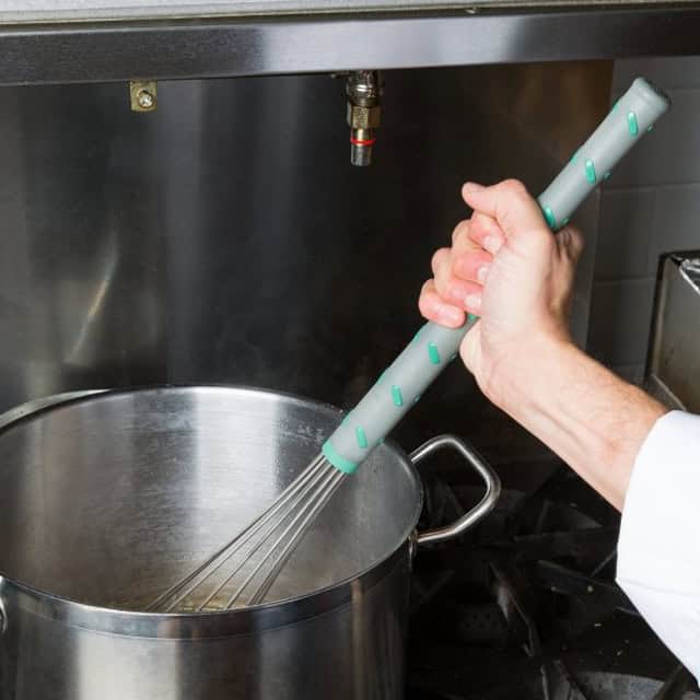 0055430_4.jpg Whisking boiling water with a silicone-handled whisk in a commercial kitchen, hygiene and sanitation, professional food prep, industrial kitchen cleaning, Beyond Hygiene Asia.
