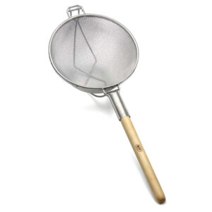 Stainless steel fine mesh skimmer with wooden handle, used in professional kitchen and food hygiene cleaning.