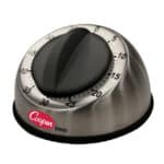 Mechanical kitchen timer for accurate time management in food preparation, branded Cooper TM60, with a stainless steel and black plastic design.
