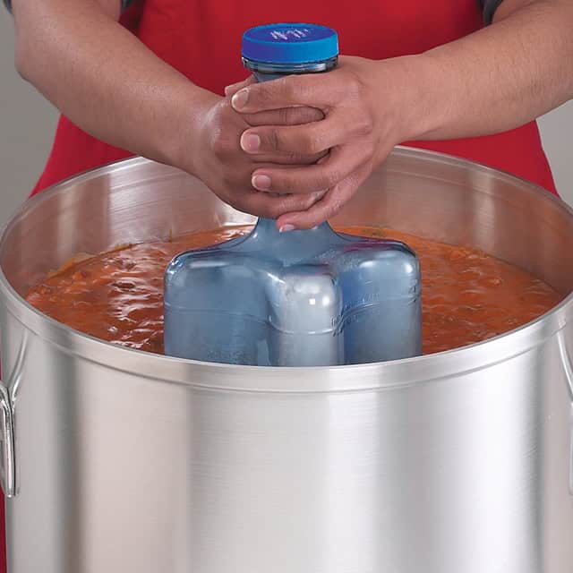 1008718_2.jpg Disinfectant gel being applied with a glove in a large stainless steel basin at Beyond Hygiene Asia.