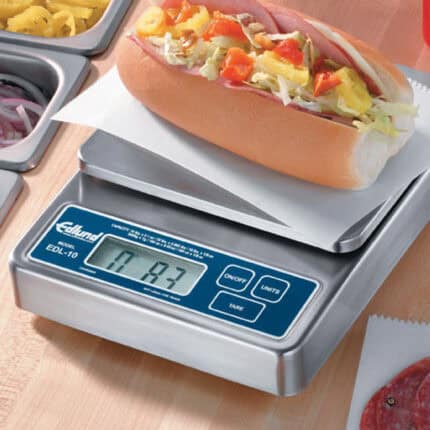 Edulab digital food scale weighing a hot dog with toppings, emphasizing food safety and hygiene standards for food preparation environments.