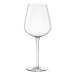 Clear wine glass with long stem on white background.