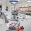 Automatic onion slicer machine for commercial kitchens and food processing.