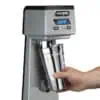 Stainless steel automatic hand sanitizer dispenser with digital countdown timer, ideal for hygiene and sanitation in Asian healthcare and public spaces.