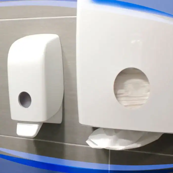 Dispenser and toilet paper holder mounted on a wall in a hygiene or restroom setting, emphasizing sanitation solutions.