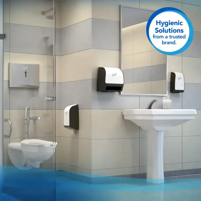 Disinfectant dispensers and hand hygiene stations in a public restroom, emphasizing hygienic solutions for sanitation and cleanliness.