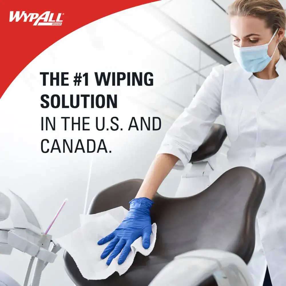 202714297_m Wypall cleaning wipe being used on dental chair for hygiene and sanitation in a healthcare setting.