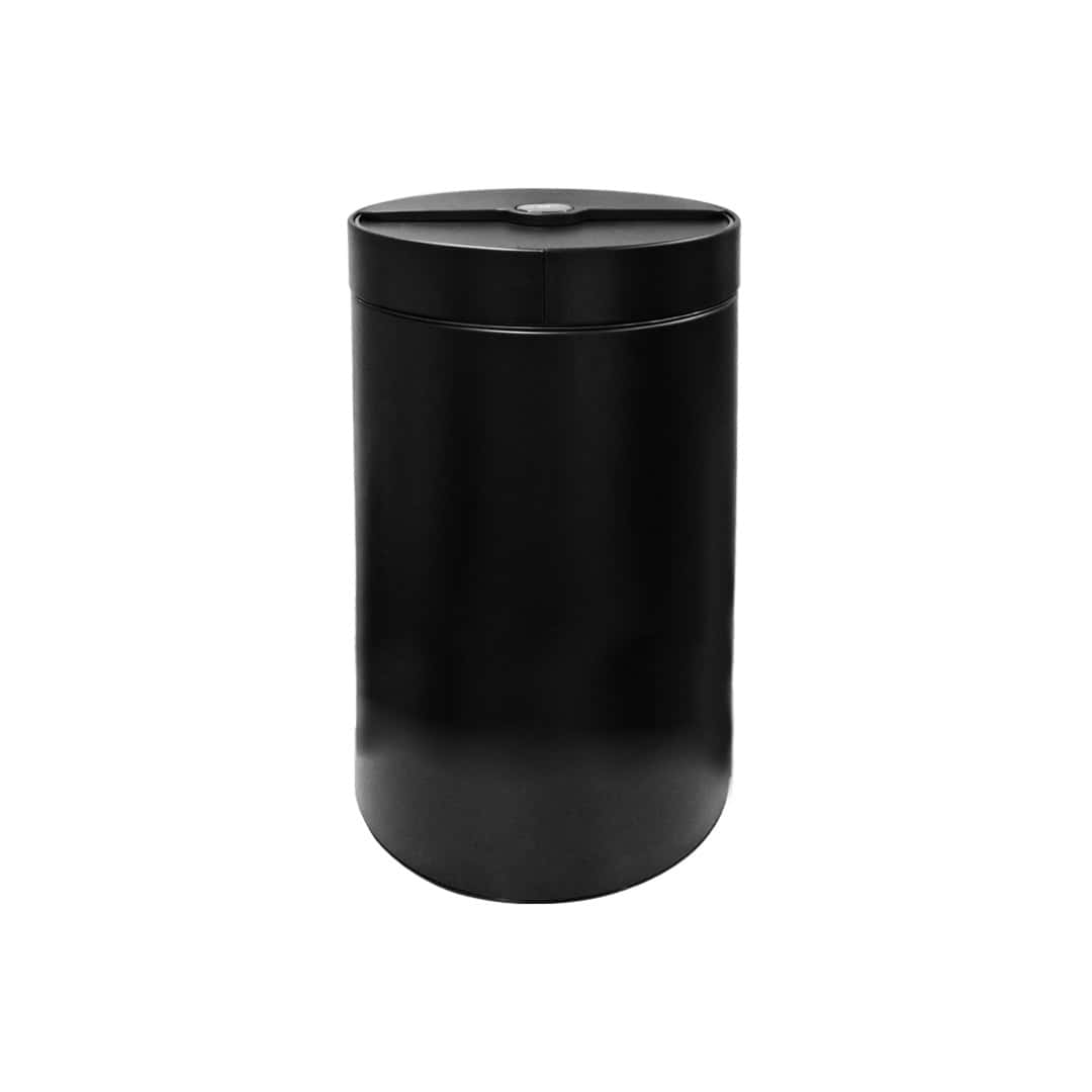 Black automatic hand sanitizer dispenser for hygiene and sanitation in public restrooms.