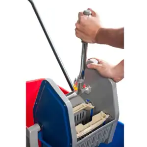 Hands cleaning a sanitation cart with disinfectant spray at Beyond Hygiene Asia.