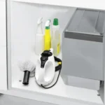 High-pressure cleaning equipment with spray bottles and scrub brush for industrial and commercial cleaning services by Beyond Hygiene Asia.