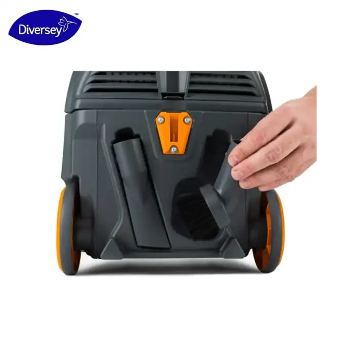 Diversey vacuum cleaner with adjustable brushes and compact design for commercial cleaning efficiency.
