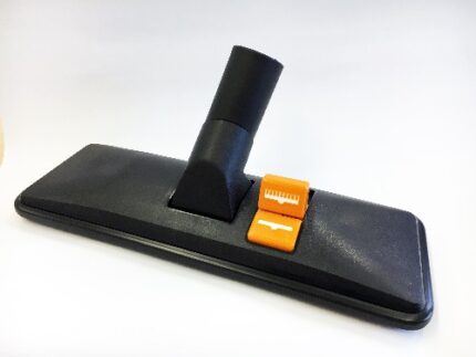 Vacuum cleaner floor attachment with hose and adjustable settings for cleaning carpets and hard floors.