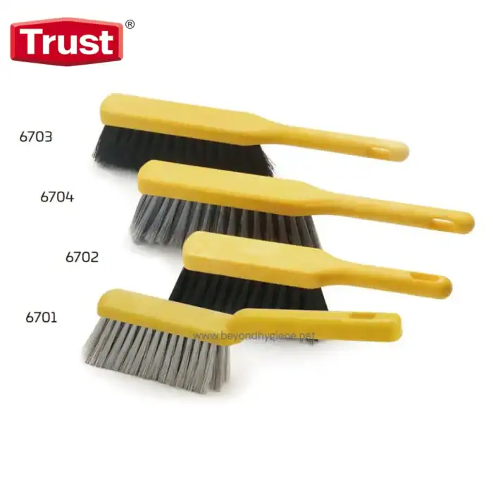 Brushes for cleaning and maintenance with yellow handles and different brush types.