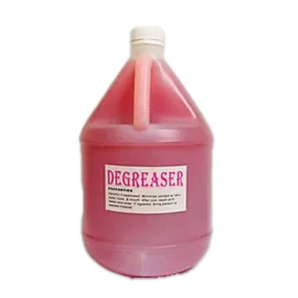 Pink liquid degreaser in plastic bottle for industrial cleaning and hygiene purposes.