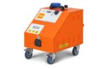 High-pressure steam sterilizer machine in orange color for medical and laboratory disinfection - Beyond Hygiene Asia.