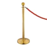 Gold stanchion with red velvet rope for event crowd control, elegance, and premium service.