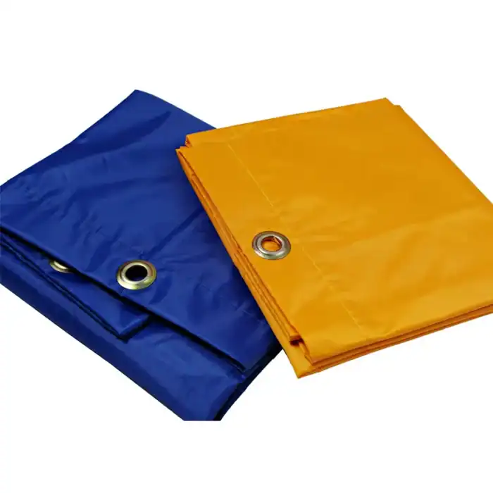 Waterproof tarpaulins for industrial and household use, available in blue and yellow, featuring metal grommets for secure fastening, ideal for protection and outdoor projects.