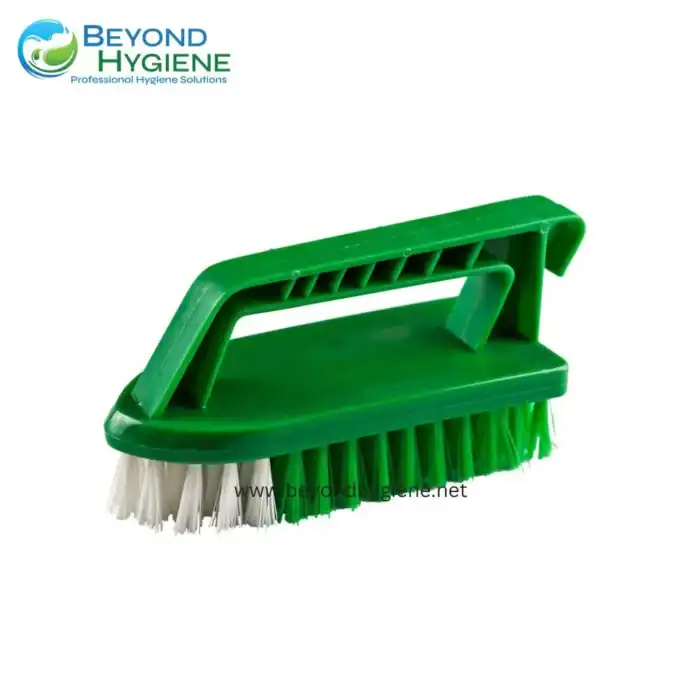 Green handheld scrub brush for cleaning surfaces, featuring durable bristles and ergonomic handle, ideal for commercial hygiene and sanitation, from Beyond Hygiene Asia.
