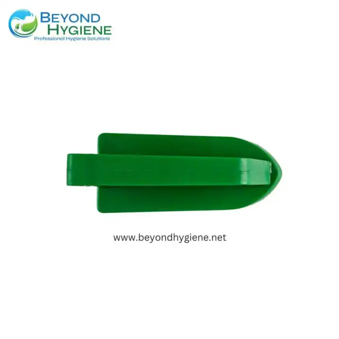 Sterile green plastic shovel for cleaning or sanitation tasks, ideal for professional hygiene solutions in commercial or industrial environments.
