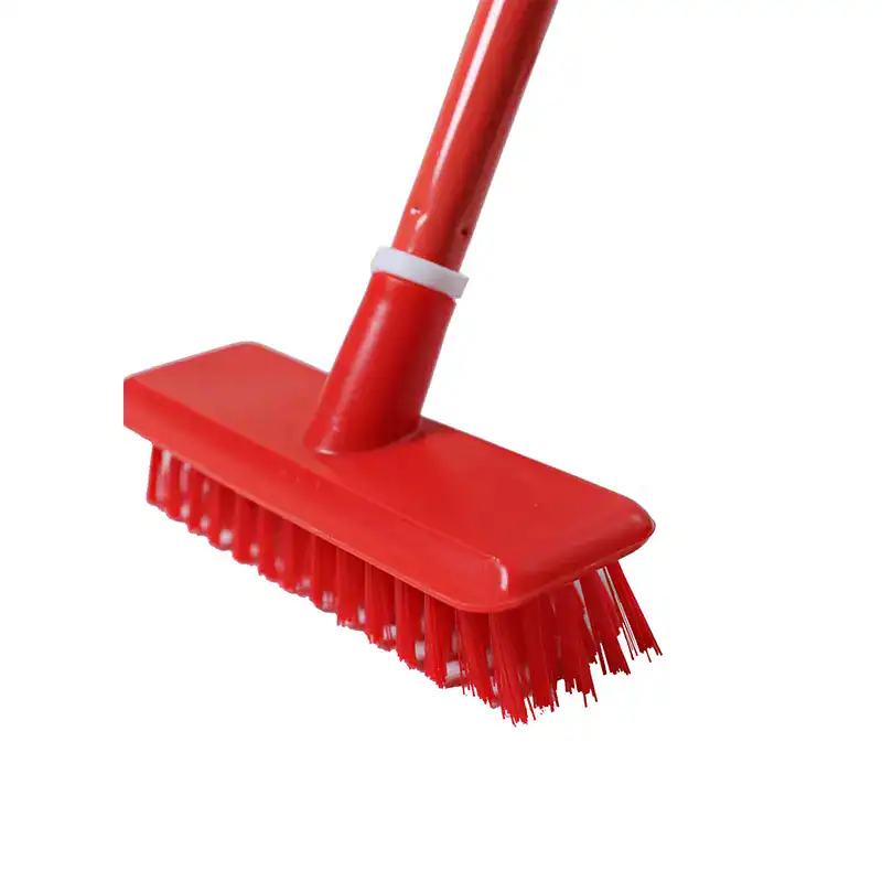 Plastic+Deck+Brush+RED-2+B Red cleaning mop with a sturdy handle, designed for efficient floor cleaning and sanitation. Perfect for commercial and industrial hygiene solutions.