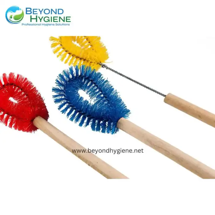 Cleaning brush tools for hygiene cleaning and sanitation, colorful scrubbers with wooden handles, suitable for professional cleaning solutions from Beyond Hygiene Asia.