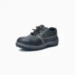Durable black safety work shoe with steel toe protection and slip-resistant sole for industrial and construction workers. Comfortable and high-quality footwear by Beyond Hygiene Asia.