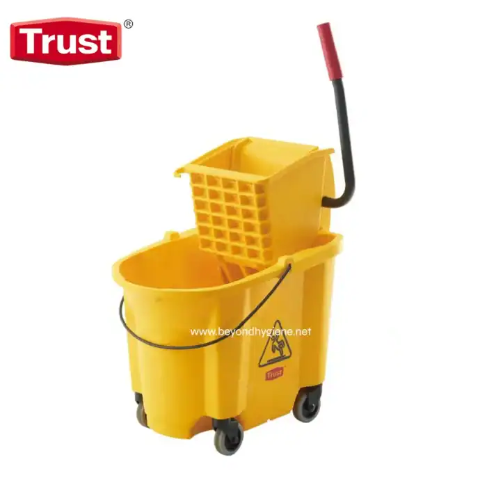 Yellow cleaning mop bucket with wringer and wheels for commercial hygiene; glossy surface, durable design for professional cleaning, ideal for janitorial sanitation services.