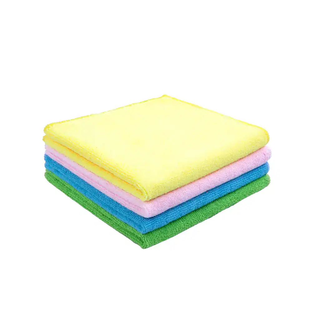 Terry Cloth Microfiber China Microfiber cleaning cloths in yellow, pink, blue, and green for commercial hygiene and janitorial cleaning services in Asia.