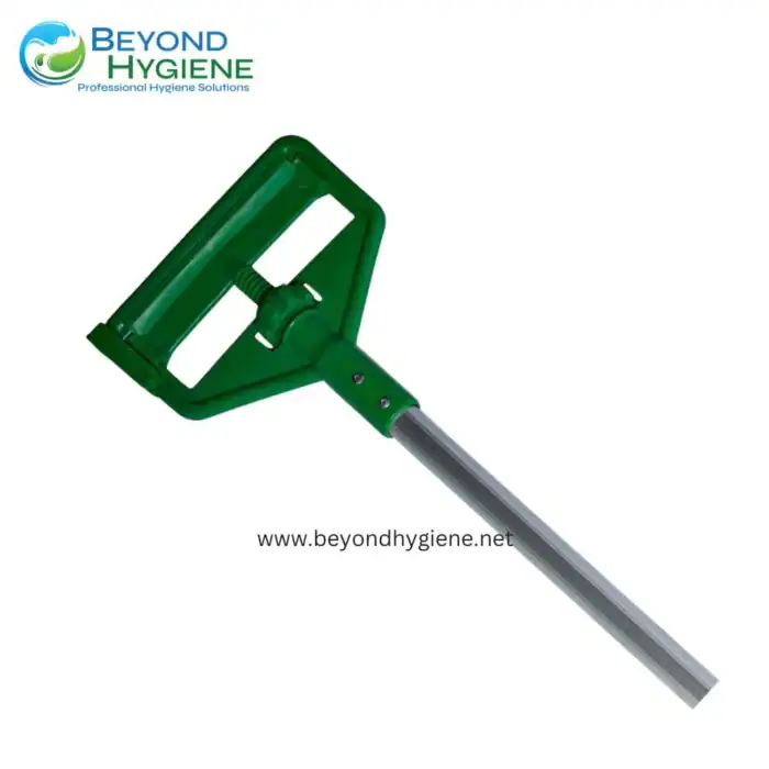Green handheld cleaning tool for hygiene maintenance.