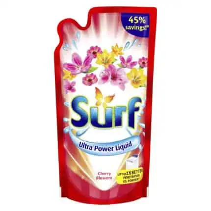 Bright pink and yellow floral laundry detergent pack with "Surf Ultra Power Liquid" and "Cherry Blossom" scent, featuring 45% savings and improved cleaning performance.