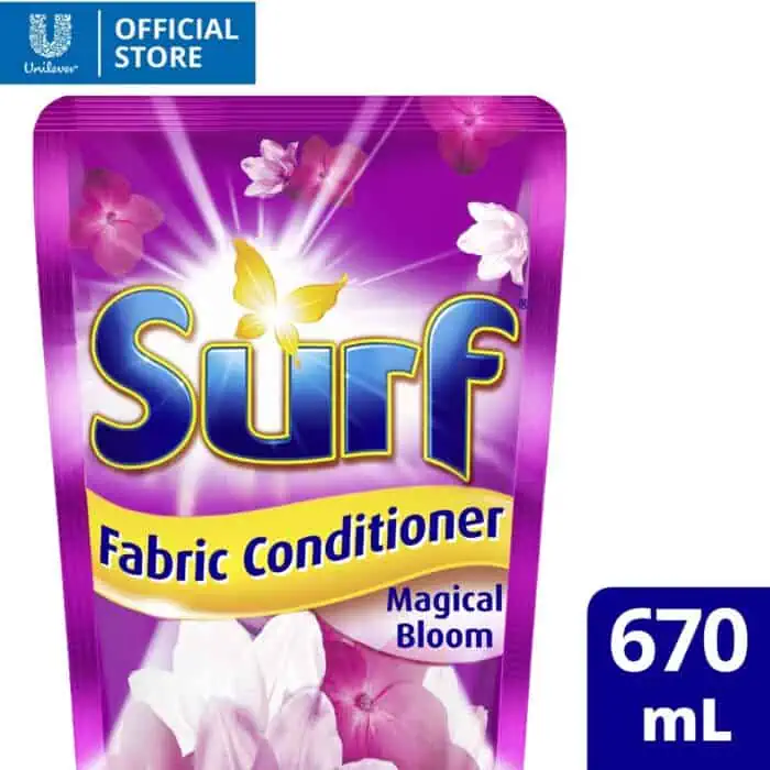 Bright purple Surf fabric conditioner pouch with floral scent, featuring a glowing butterfly logo and product name, promoting fresh and fragrant laundry with magical bloom fragrance.