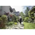 Efficient garden cleaning by Beyond Hygiene Asia, showcasing professional pressure washing services for residential outdoor spaces, ensuring a clean and hygienic environment.