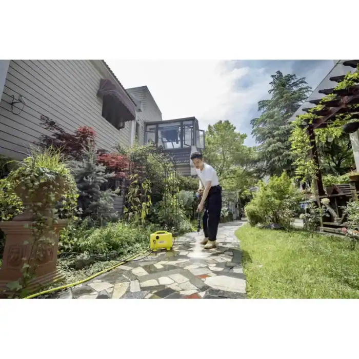 Efficient garden cleaning by Beyond Hygiene Asia, showcasing professional pressure washing services for residential outdoor spaces, ensuring a clean and hygienic environment.