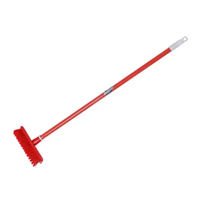 Red push broom with durable bristles for commercial and industrial cleaning. Perfect for sweeping large areas efficiently, ideal for use in warehouses, garages, and outdoor spaces.