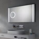 Mirror with LED lighting and modern faucet in a sleek bathroom setup at Beyond Hygiene Asia.