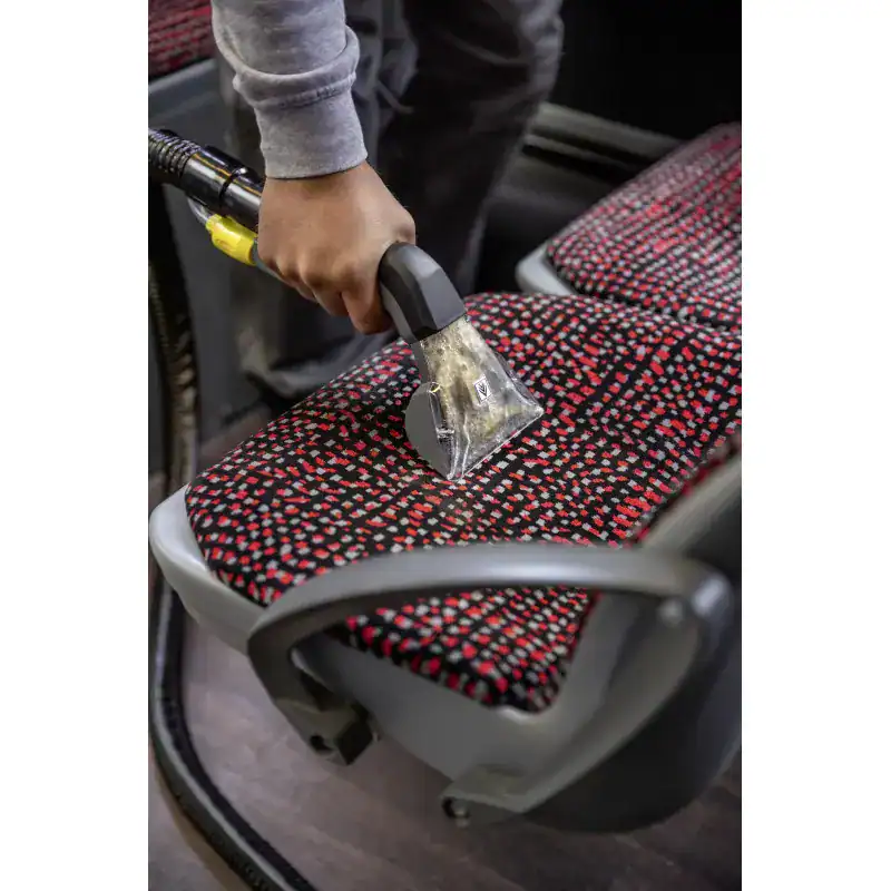 puzzi-8-1-eu (6) Disinfecting bus seat with steam cleaning equipment for hygiene and sanitation in Asia.
