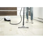 High-pressure steam cleaner sanitizing tiled floor, professional cleaning service, Beyond Hygiene Asia.