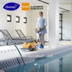 Industrial cleaning equipment in a modern indoor pool area, representing professional hygiene solutions for pool maintenance and sanitation.