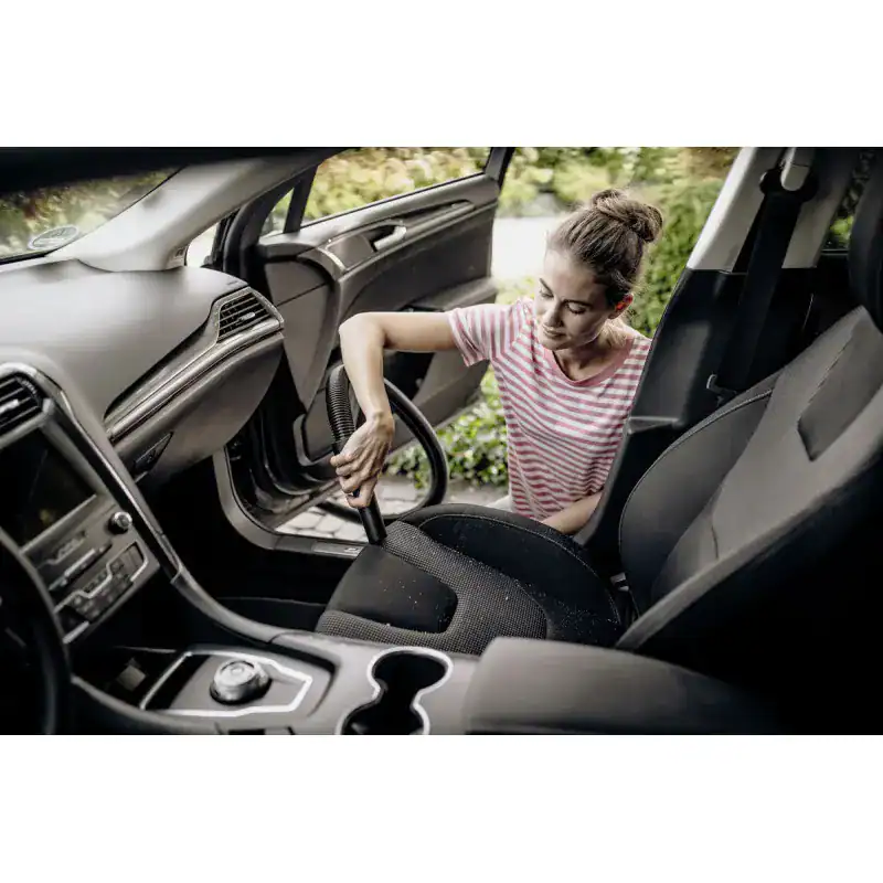 wd-2-plus-v-12-4-18-c (2) Disinfecting car interior with vacuum cleaner for hygiene and cleanliness.