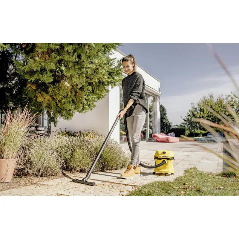 wd-2-plus-v-12-4-18-c (3) Vacuum cleaner outdoor garden cleaning, woman using yellow vacuum outside, eco-friendly cleaning, beyond hygiene asia, professional cleaning services.